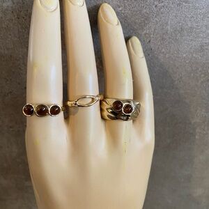Cato brand women's fashion rings featuring gold tone finish amber-colored stones
